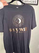 Load image into Gallery viewer, Medium stay wild moonchild gold design unisex tshirt in black
