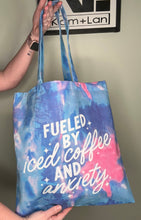 Load image into Gallery viewer, Tote bag; fueled by iced coffee and anxiety cotton candy blue and pink 15”x16”
